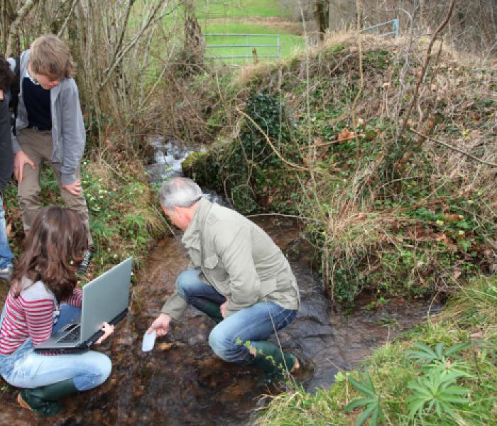 Environmental education professor and students on location image