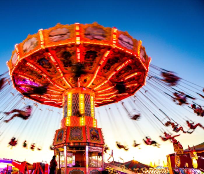 spinning amusement ride with swings