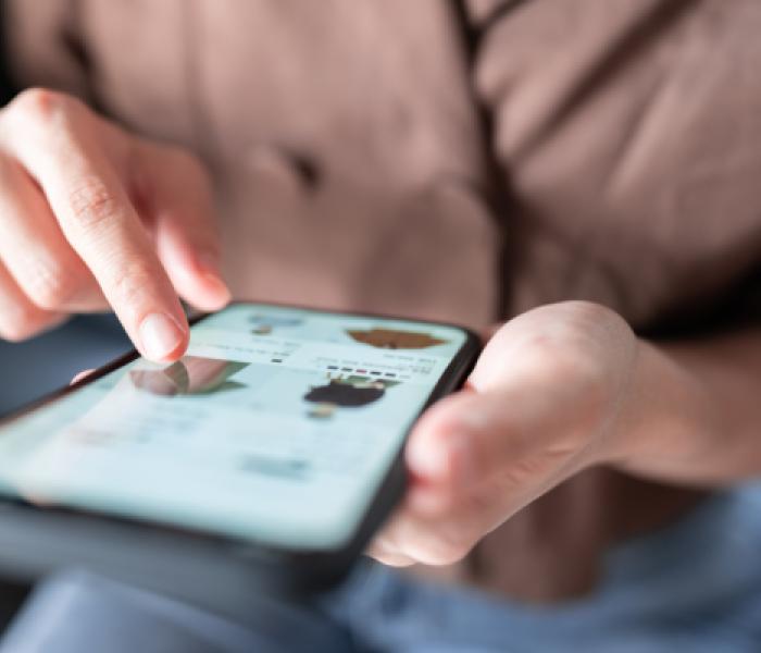 person scrolling through a cell phone