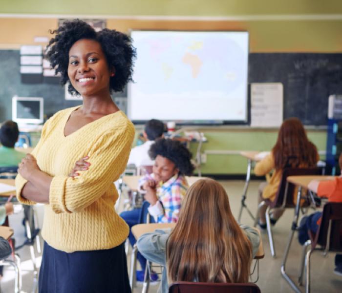 Teacher in a classroom with students image